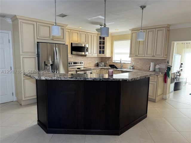2448 Holly Ln ., Palm Beach Gardens, FL 33410