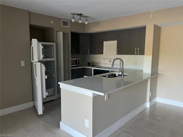 1205 Wildwood Lakes BLVD 203, Naples, FL 34104