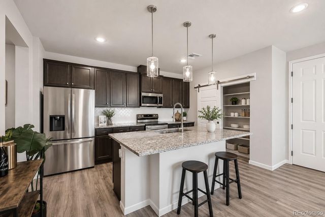 6153 N Ceylon Street 10-303, Denver, CO 80249