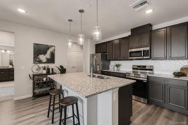 6153 N Ceylon Street 10-303, Denver, CO 80249