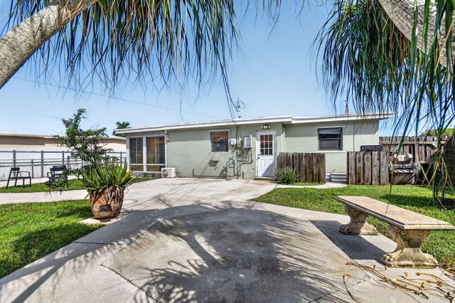 5678 Cinnamon Drive, West Palm Beach, FL 33415