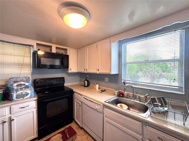 6008 AMBERLY AVENUE F63, Orlando, FL 32822