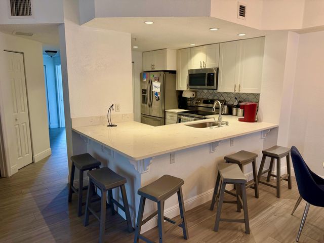 3018 Alcazar Place 101, Palm Beach Gardens, FL 33410