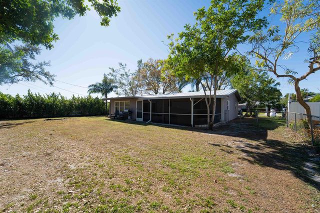 477 SE Asbury Lane, Port St. Lucie, FL 34983