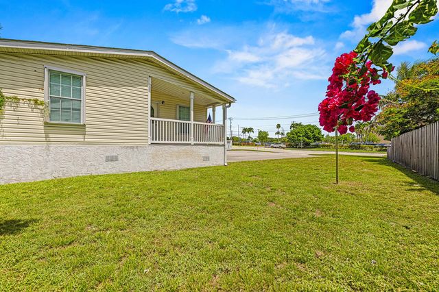 10105 SW Sandalfoot Boulevard, Boca Raton, FL 33428
