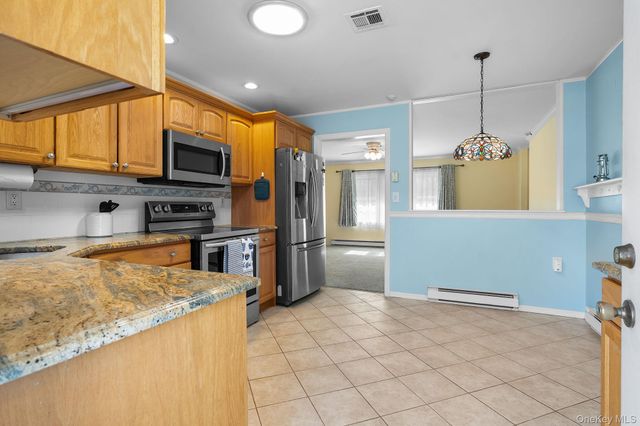54 Aylesbury Court B, Ridge, NY 11961