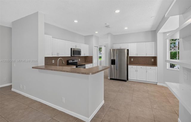 498 Cambridge Ln, Weston, FL 33326