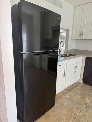 4949 Regina Court, West Palm Beach, FL 33415