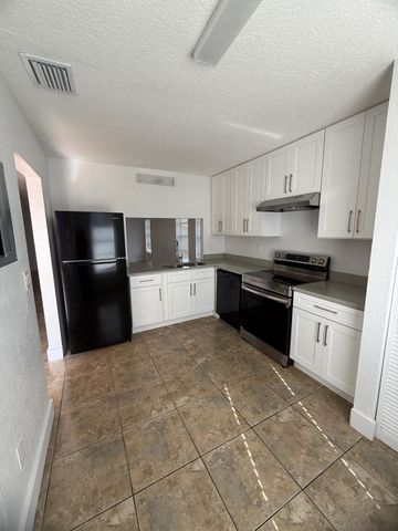 4949 Regina Court, West Palm Beach, FL 33415