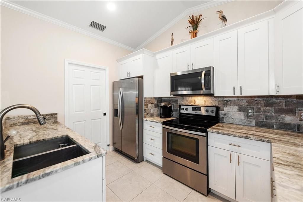 Image 2 of property listing at 4548 SW 16th PL, Cape Coral, FL 33914