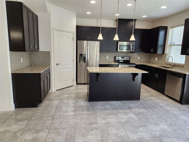 9817 WINNINGTON STREET, Orlando, FL 32832