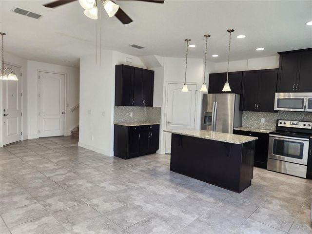 9817 WINNINGTON STREET, Orlando, FL 32832