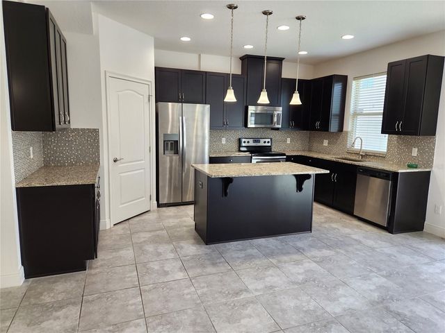9817 WINNINGTON STREET, Orlando, FL 32832