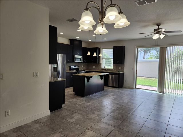 9817 WINNINGTON STREET, Orlando, FL 32832