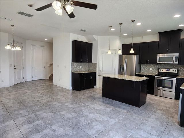 9817 WINNINGTON STREET, Orlando, FL 32832