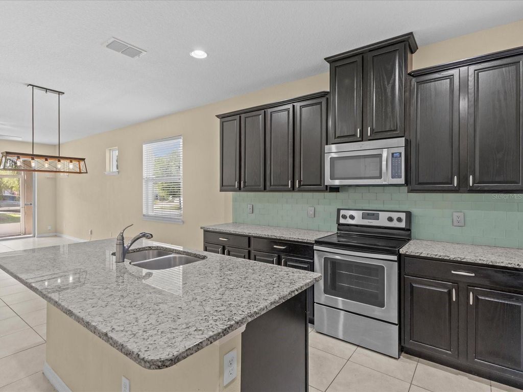 Image 6 of property listing at 12121 HOMESTEAD PARK LANE, Orlando, FL 32824