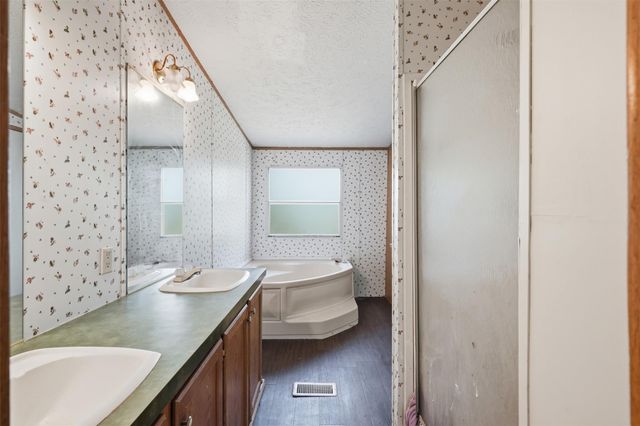 910 County Road 3556, Cleveland, TX 77327
