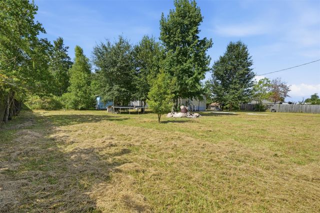 910 County Road 3556, Cleveland, TX 77327