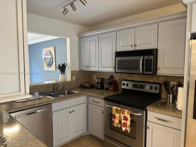 9805 Costa Del Sol Blvd C-102, Doral, FL 33178