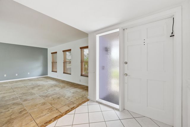 9696 Honeysuckle Avenue, Palm Beach Gardens, FL 33410