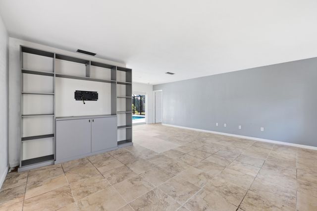 9696 Honeysuckle Avenue, Palm Beach Gardens, FL 33410