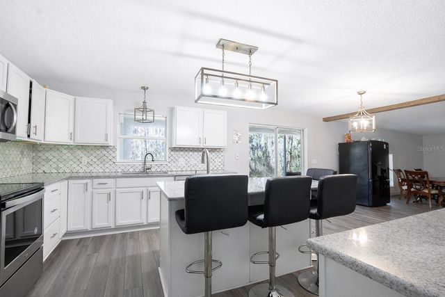 1033 TAWNY EAGLE DRIVE, Groveland, FL 34736