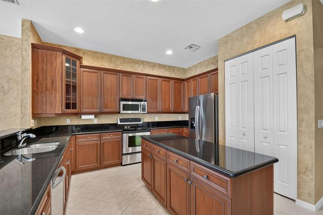 9377 Madewood Court, Royal Palm Beach, FL 33411