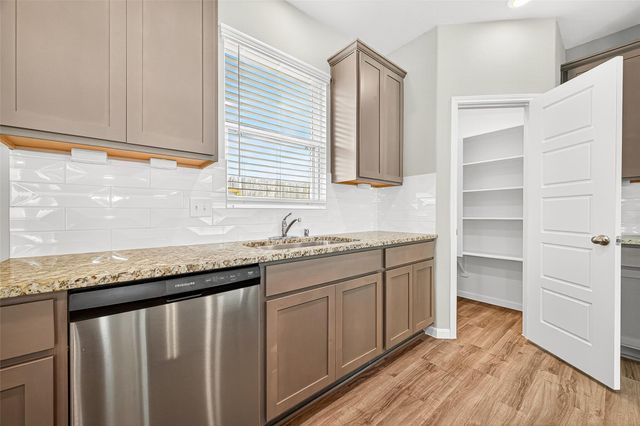 9975 Enclave Grove Drive, Willis, TX 77318