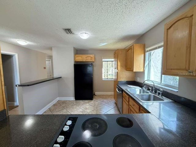 118 DAHLIA VILLAGE CIRCLE 79, Orlando, FL 32807