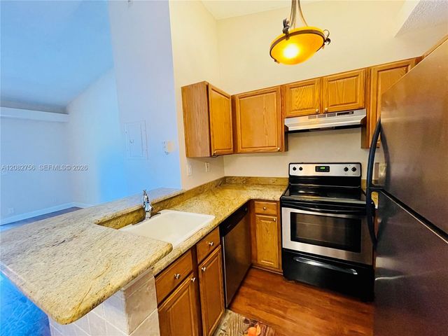 641 Lyons Road 11207, Coconut Creek, FL 33063