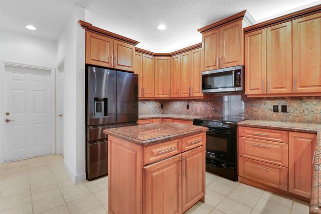 12 Grand Bay Circle, Juno Beach, FL 33408