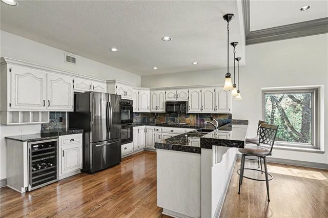 2401 SW Whispering Creek Court, Blue Springs, MO 64015