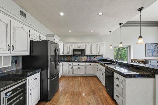2401 SW Whispering Creek Court, Blue Springs, MO 64015