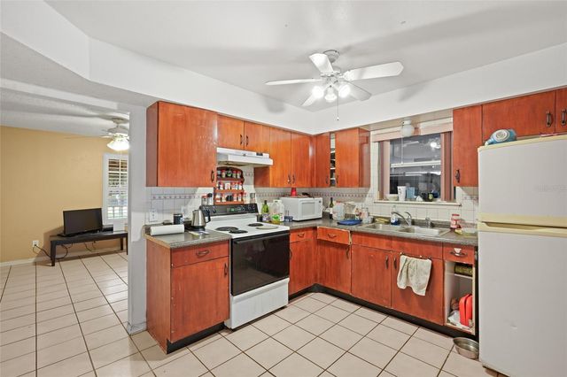 10102 FLOWERS AVENUE, Orlando, FL 32825