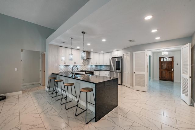 9407 PEBBLE GLEN AVENUE, Tampa, FL 33647