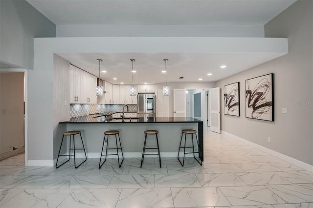 9407 PEBBLE GLEN AVENUE, Tampa, FL 33647