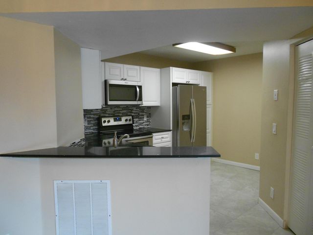 8977 Wiles Road 203, Coral Springs, FL 33067