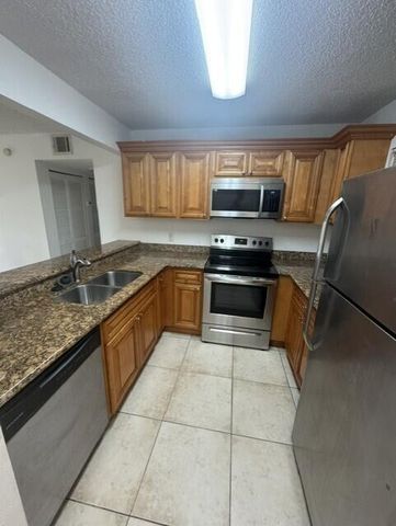 1495 LAKE CRYSTAL Drive G, West Palm Beach, FL 33411