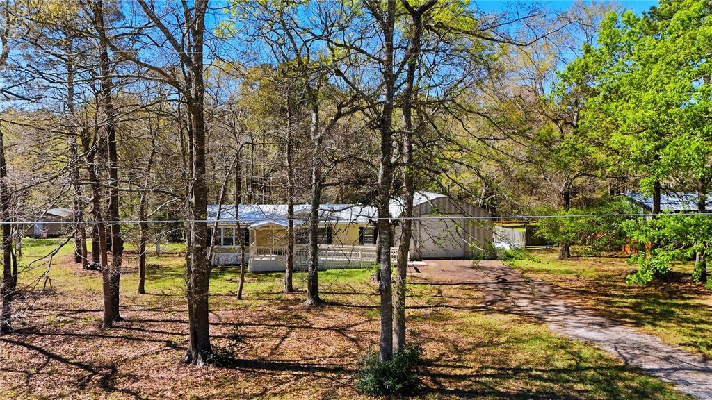 Image 2 of property listing at 4484 Grand Oaks Drive, Willis, TX 77378