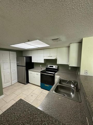 5005 Wiles Road 102, Coconut Creek, FL 33073
