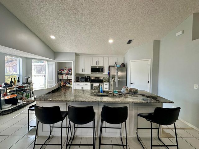 119 Hammocks Court, Greenacres, FL 33413