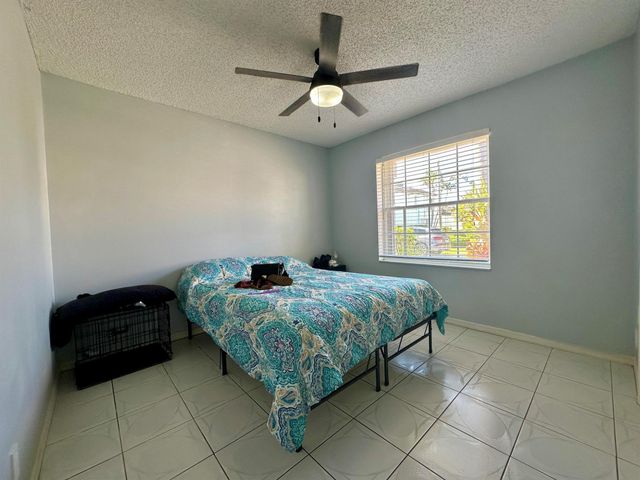 119 Hammocks Court, Greenacres, FL 33413