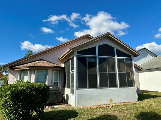 119 Hammocks Court, Greenacres, FL 33413