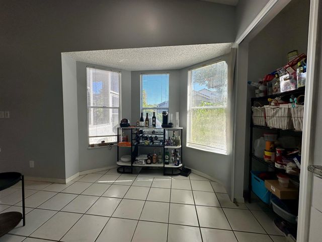 119 Hammocks Court, Greenacres, FL 33413