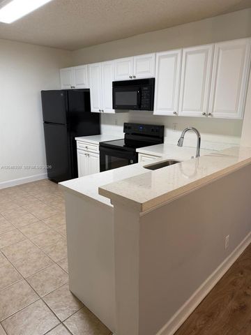 5761 Riverside Drive 304B4, Coral Springs, FL 33067