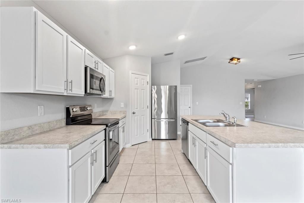 Image 3 of property listing at 1319 NW 14th PL, Cape Coral, FL 33993
