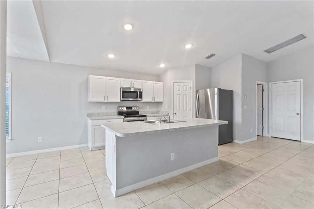 Image 6 of property listing at 1319 NW 14th PL, Cape Coral, FL 33993