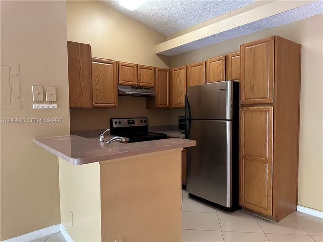 731 Lyons Road 16203, Coconut Creek, FL 33063