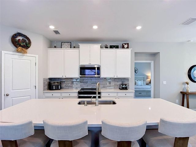 7677 BROAD RIVER AVENUE, Land O Lakes, FL 34638