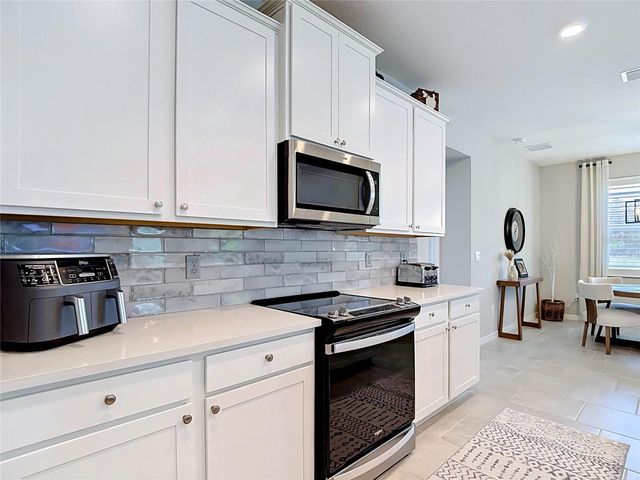 7677 BROAD RIVER AVENUE, Land O Lakes, FL 34638